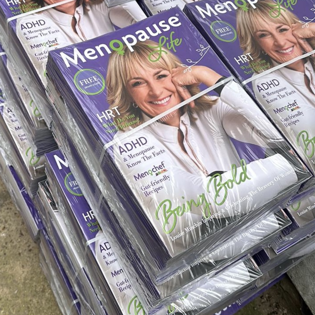 Stacks of Menopause Life magazines ready for distribution.
